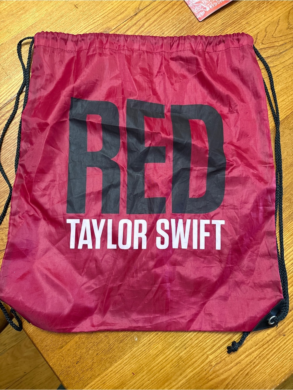 Taylor Swift Red and Black Logo Drawstring Bag